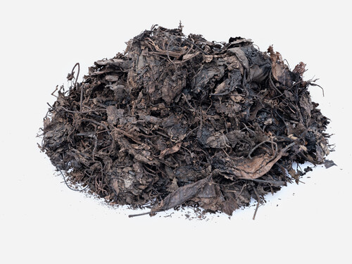 a pile of black leaf mulch on a white background