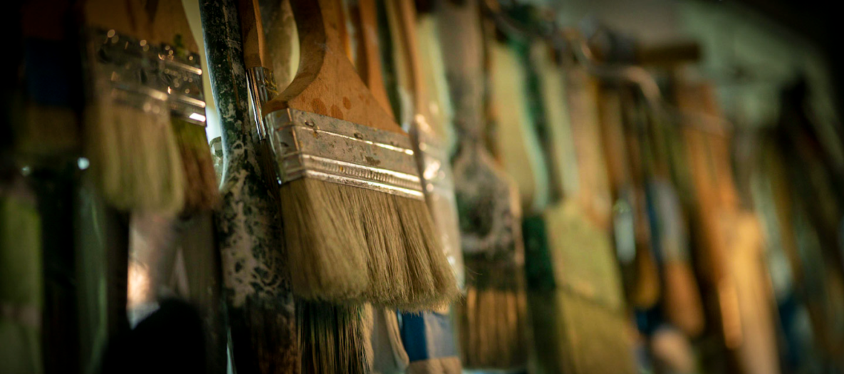 Closeup of hanging paintbrushes