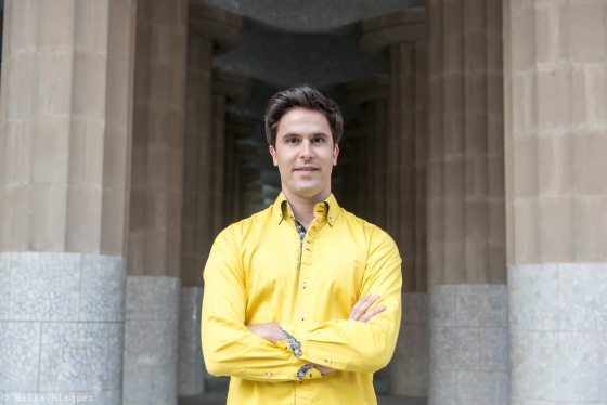 raul ramirez facing the camera in a yellow shirt