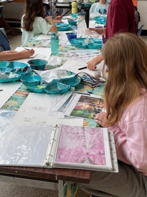 Young children crafting at a table.