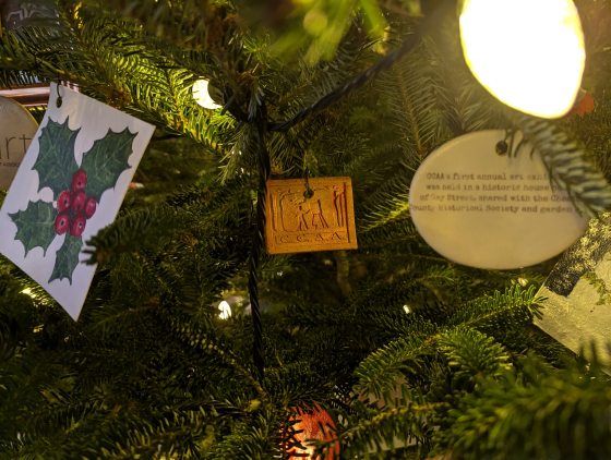 A Christmas tree decorated with handmade ornaments.